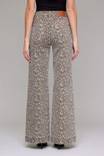 Load image into Gallery viewer, Hidden Cheetah Flare Jeans
